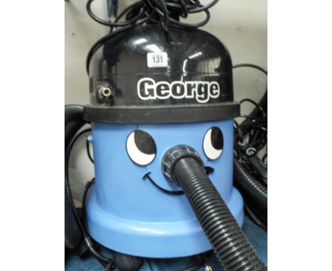 A George Henry style carpet cleaner in blue case 
