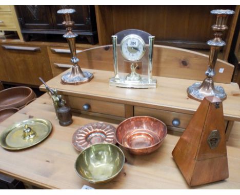 A pair of plated candlesticks, a mantle clock, a metronome, brass and copper dishes etc 