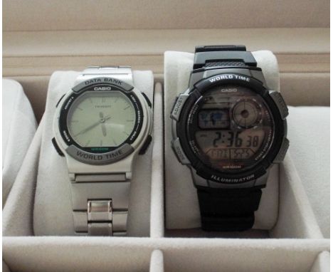 Two gents Casio wrist watches and a watch display case 
