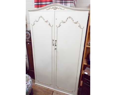 A cream and gilt two door wardrobe, 3'6 wide 