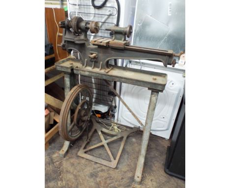 An early Drummond 3.5" flat bed metal workers lathe with treadle base by Drummond Bros of Gilford Surrey circa 1902 with orig