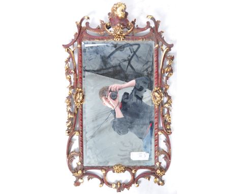A beautiful antique style Rococo influence wall mirror having a gilt scroll and cherub putti frame with inset mirror panel. M