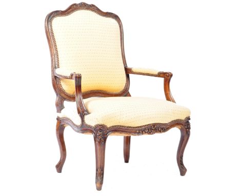 A 19th Century French antique oak fauteuil armchair open arm chair having a hand raved cushioned back rest top, with cushione