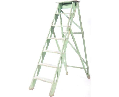 A decorative set of 19th Century French antique painted cherrywood set of steps step ladder having a metamorphic folding acti