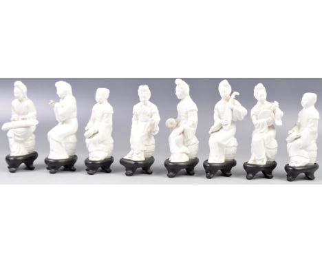 A collection of antique Chinese Blanc De Chine porcelain musical figurines on hardwood sockel bases. The white porcelain figu