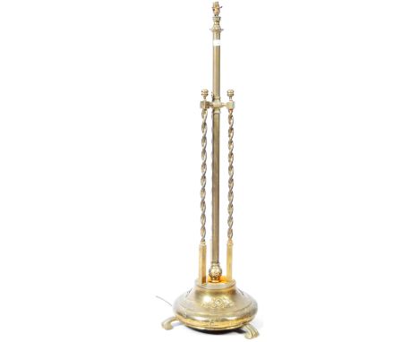 A good early 20th Century Art Nouveau floor standing light / upright lamp standard of brass construction having a central cyl
