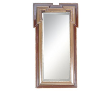 A 19th Century English antique mahogany framed pier mirror / wall mirror having a geometric frame with carved mouldings surro