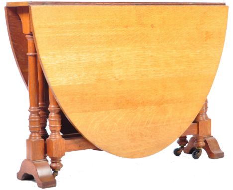 A 19th Century Victorian English antique light golden oak double gate Sutherland dining table having twin drop leaves with me