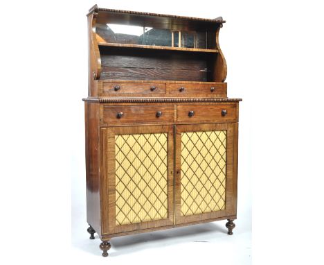 A 19th Century Georgian Regency period English antique rosewood chiffonier sideboard having a mirror panel waterfall scrolled