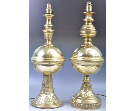 A near matching pair of 20th Century English antique Art Nouveau style brass lamps with both having ribbed stem decoration ov