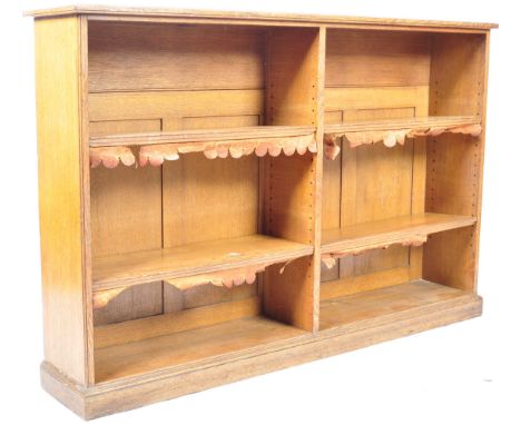 A 19th Century Victorian English antique light oak library open bookcase comprising of a two section shelf bookcase with four