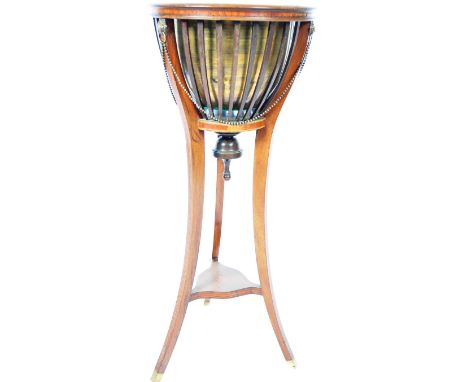 An early 20th Century Edwardian English antique Empire style oak and tulipwood inlay jardiniere of basket form having an inse