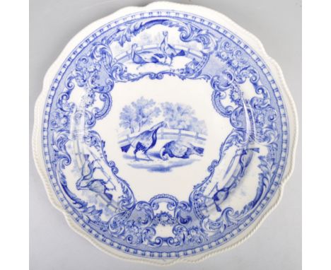 An antique late Copeland Spode blue and white pattern Cockfighting cabinet plate. The porcelain plate depicting a Cockfightin