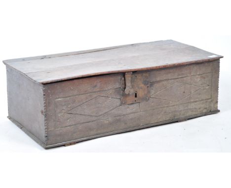 A rare 17th Century English antique Jacobean oak bible box having a hinged lid set on the original wrought iron hook hinges, 