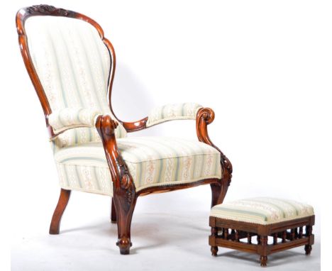 A 19th Century Victorian English antique walnut fauteuil open armchair arm chair and matching footstool. Carved top with beau