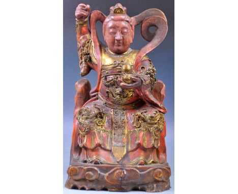 A large 19th Century Chinese antique hand carved wooden sculpture statue depicting the Goddess Guanyin. Modelled seated with 