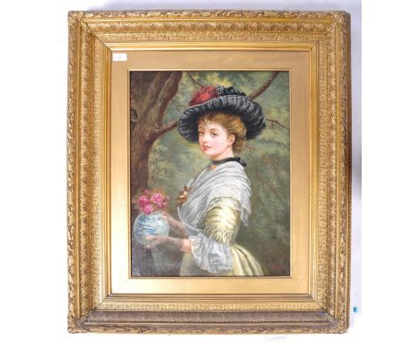 A beautiful 19th Century European oil on canvas Parisian painting portrait study depicting a lady in period attire holding a 