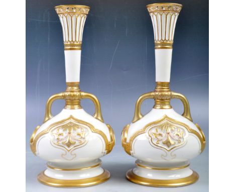 A pair of 19th Century Royal Worcester fine English antique bone china vases having a white ground with hand gilded detailing