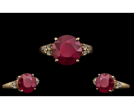 Ladies 9ct Gold Single Stone Ruby Ring with Stone Set Shoulders. The Large Round Faceted Ruby of Deep Red Colour, Est Weight 