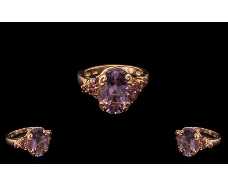 Rose de France Amethyst Fancy Mount Ring, an oval cut Rose de France amethyst of 5cts, held by four scrolled claws in a simil