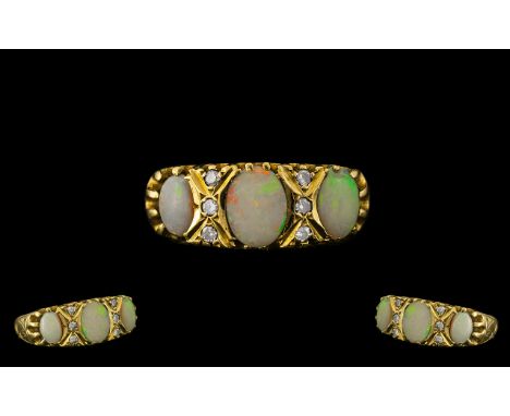 Antique Period Attractive 18ct Gold Opal and Diamond Set Ring with ornate gallery setting; fully hallmarked for 18ct; the thr