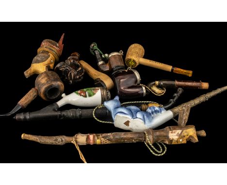 Collection of 10 Vintage Pipes comprising 5 Black Forest type carved pipes, an American corn-cob pipe, a Bavarian painted por