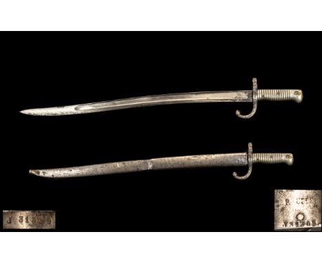 French Bayonet and Scabbard, dated Jun.1869, No. JJ 313609, plus maker's stamps; with a brass plated hilt; 28 inches (70cms) 