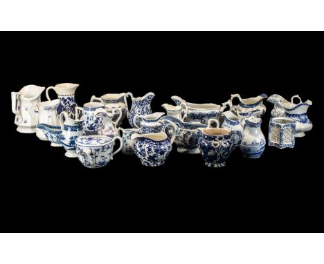 Twenty-five Antique Blue and White Pottery Jugs and Gravy Boats, various Staffordshire factories of the period - Wood &amp; S