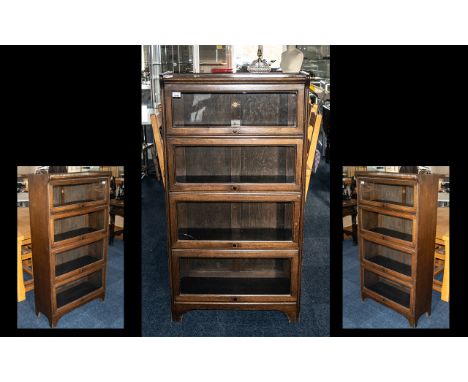 1920s Oak One Piece Barrister's Bookcase by Kenrick Jefferson, four sectional glazed tilt and slide front, raised on bracket 