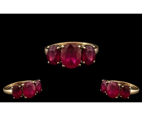 Ladies Attractive / Pleasing 9ct Gold - 3 Stone Ruby Set Dress Ring. The Rubies of Excellent Colour. Est Weight In Total 6.00