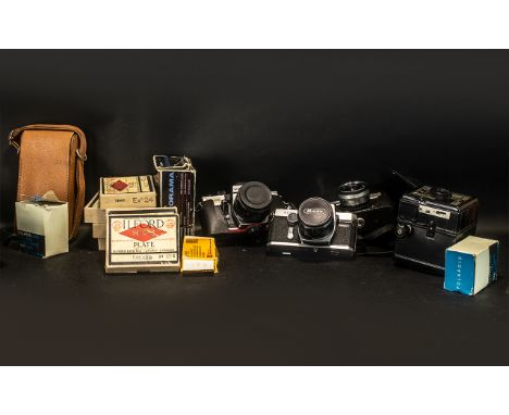 A Collection of Cameras to include Miranda Panorama, Polaroid Black and White 3000 land roll film, Praktica TL 5B, Richoh Sin