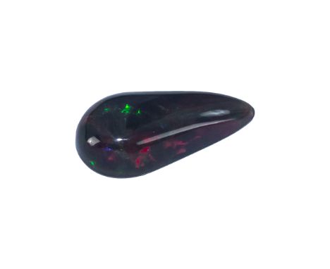 A Ethiopian Ruby Red Pear Shaped Opal length 20mm x 10mm  x 5mm. Est carat weight 3.85.