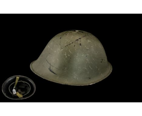 British Steel Helmet, turtle pattern, with original liner dated 1952, and chin strap. 