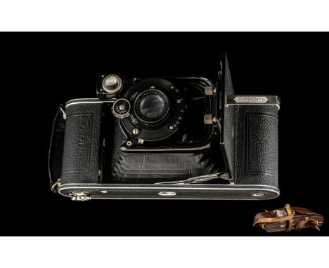 Zeiss Ikon Folding Camera in original brown leather case.