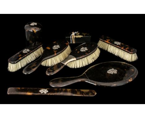 Eight Piece Victorian Lady's Dressing Table Set, in tortoiseshell with applied silver monograms. Hand mirror, brushes, trinke