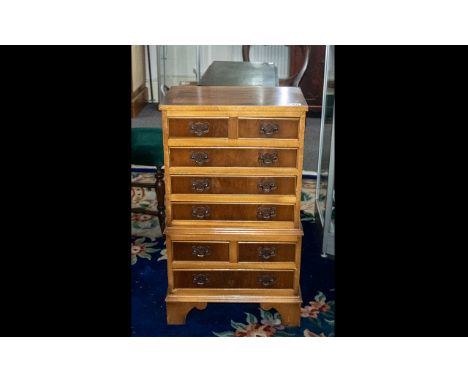 Small Reproduction Yew Wood Chest on Chest, with brass fret work handles, graduated drawers and bracket feet; 32 inches (80cm
