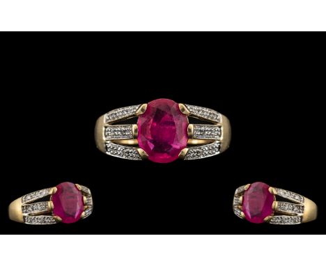 Ladies 9ct Gold Attractive Ruby and Diamond Set Dress Ring. Fully Hallmarked for 9.375. The Central Faceted Ruby of Good Rich