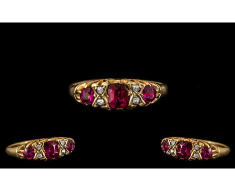 Antique Period 18ct Gold Attractive Ruby and Diamond Set Ring in a gypsy-gallery setting, the rubies of good colour, with dia