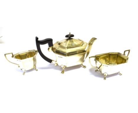 ART DECO STERLING SILVER TEA SERVICE  Of Geometric form, with neo-classical shaped handles, to include a teapot, sugar bowl a