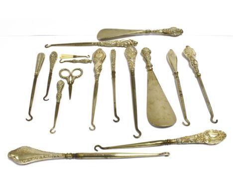 ANTIQUE SILVER MOUNTED BUTTON HOOKS  With beautifully embossed handles, variously hallmarked also similar shoe horns and a pa