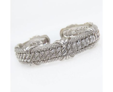 Judith Ripka 18 Karat White Gold Hinged Cuff Bangle. Signed, 750. Good condition. Measures 1/2" W, 2-1/8" interior diameter. 