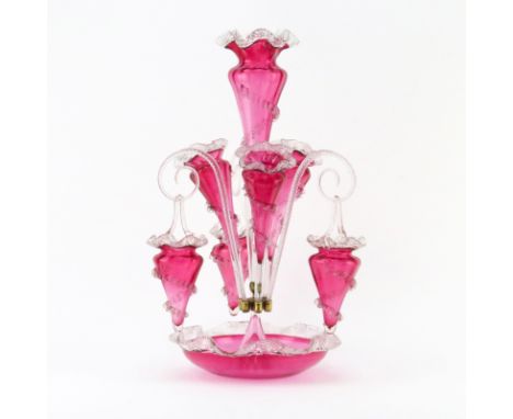 Victorian Style Cranberry to Clear Art Glass Flower Epergne. Includes three horns and three hanging baskets. Needs cleaning. 