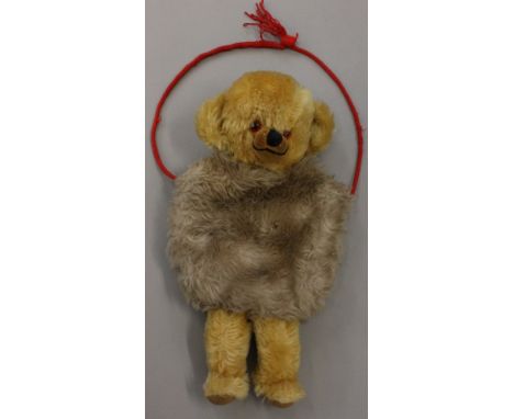 Merrythought 1950's Cheeky Bear Muff, velveteen snout and pads, stitched nose and mouth, red cord, bells in ears. Height 36cm