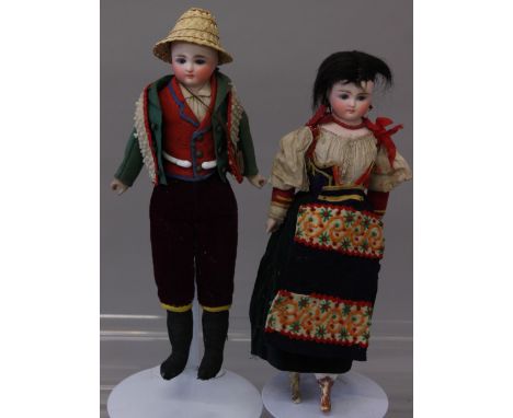 Mid 19th century pair of fine bisque shoulder head dolls, possibly French, with fixed glass blue eyes and painted features, o