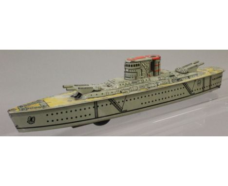 Marx Toys (England) HMS Edinburgh tinplate Battleship, with detailed tinprinting, friction drive motor in working order, leng