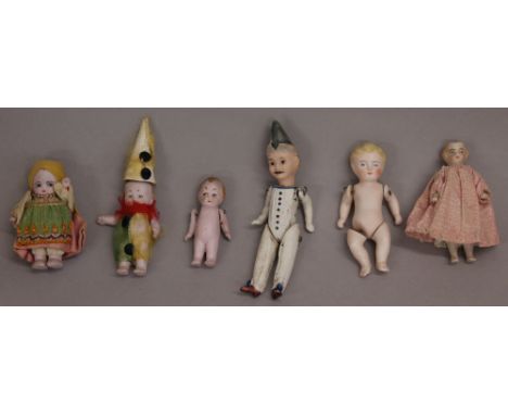 Miniature porcelain clown doll, with painted face and moustache, pointed hat, painted white outfit with blue buttons, wire to
