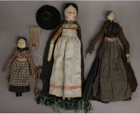 Three Dutch style wooden peg dolls in Welsh dress, c.late 19th/early 20th century: one with small head, home-spun clothes, We