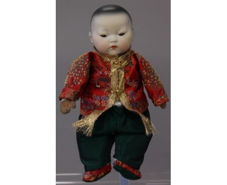 Late 19th/early 20th century Oriental bisque head doll, impressed '2 Germany', probably Armand Marseille, having flange neck,