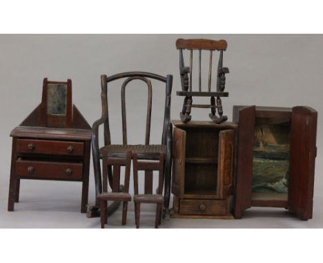 Quantity of wooden doll's furniture including chairs, bedroom suite and three-piece suite. Wardrobe measures 30cm in height. 