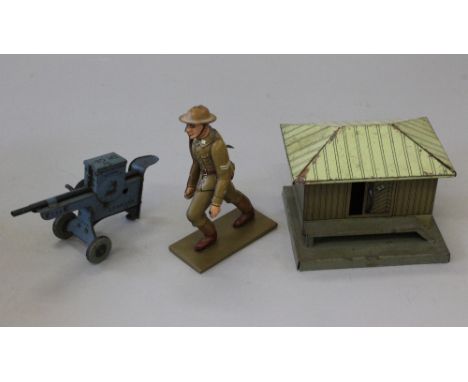 Three military related tinplate toys: Lehmann (Germany) Em Ge Marke Machine Gun, blue lithographed tin, self standing with si